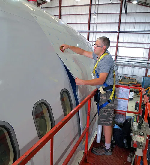 Vinyl graphics installation on plane